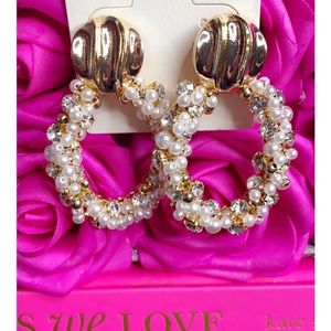 Gold water drop statement earrings